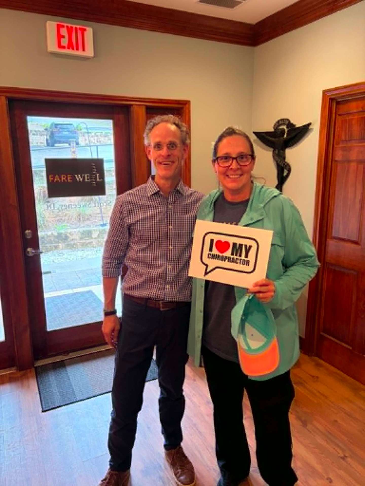 Dr. Sweeney with a patient at the Welcome Back Austin front door